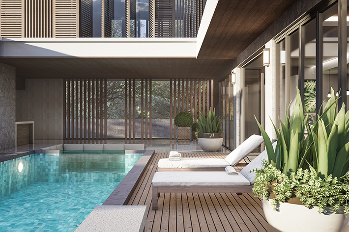 Modern outdoor pool area with lounge chairs and potted plants.